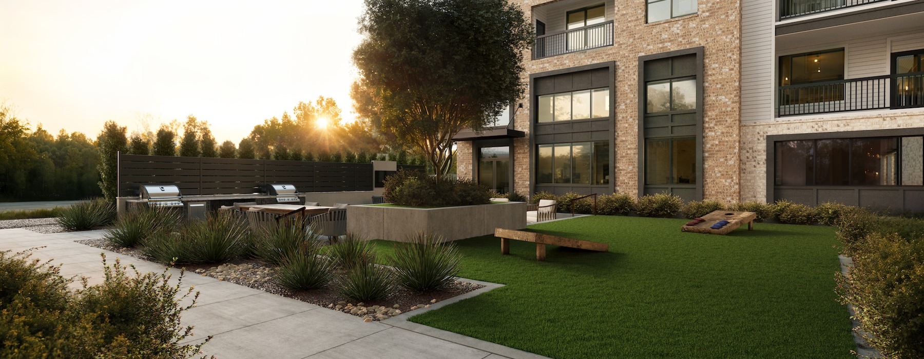 a building with a lawn and trees