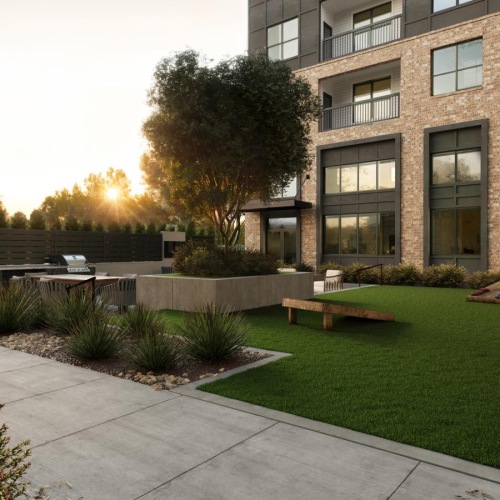 a building with a lawn and trees